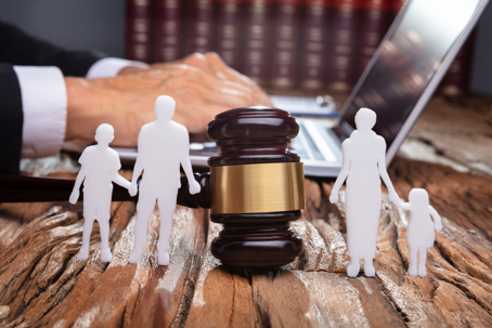 family cutout with gavel in the middle