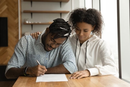 Couple signing prenup
