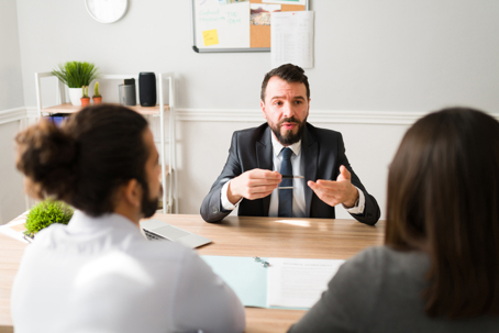 divorcing couple talking to a lawyer