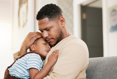 father hugging child