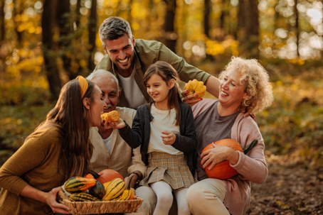 family enjoying fall weather outside