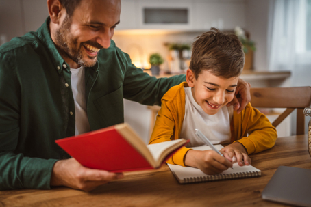 father helping son with homework